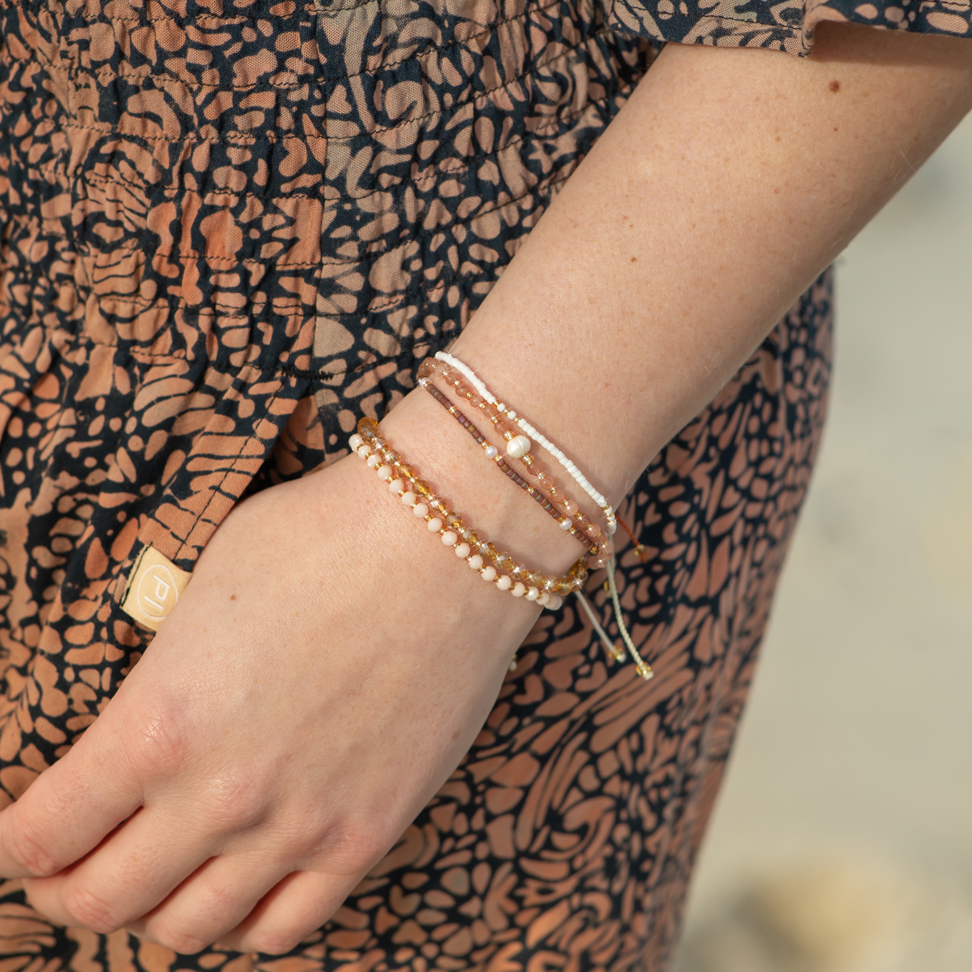 Light Pink and Gold Beaded String Bracelet